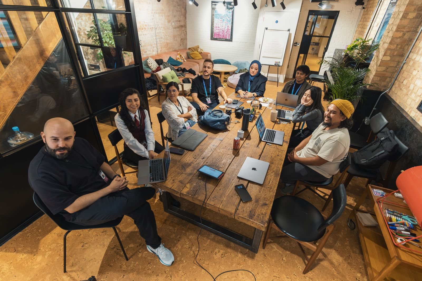 A small business team reviewing work together around a table